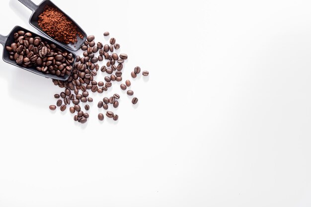 Ground coffee, coffee beans, white background