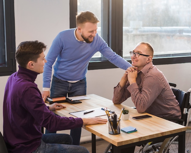 Group of adult men working at the office