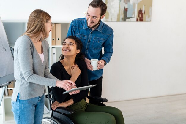 Group of adult people working on a project together