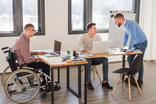 Group of adult workers at the office together