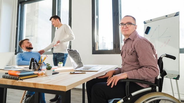 Group of adult workers together at the office