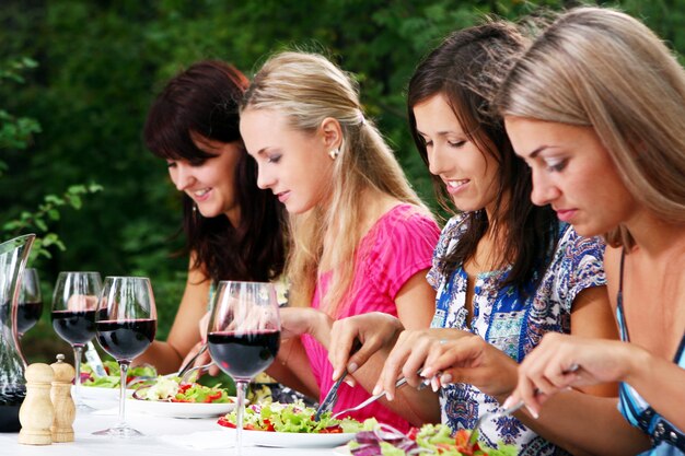 Group of beautiful girls drinking wine