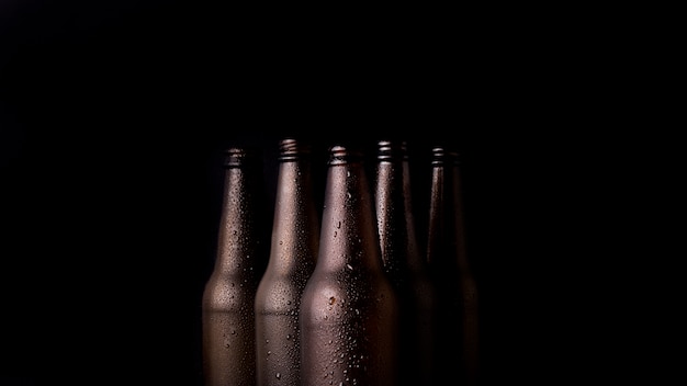 Free photo group of black beer bottles