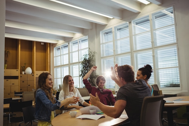 Free photo group of business executives giving high five