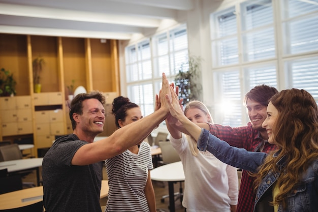 Free Photo group of business executives giving high five