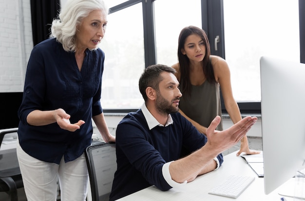 Group of business people discussing financial plan at the table in an office