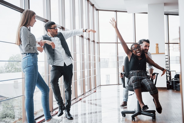 Free Photo a group of business people having fun, at the office.