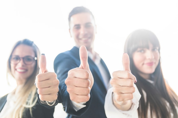 Free Photo group of business people showing thumb up sign