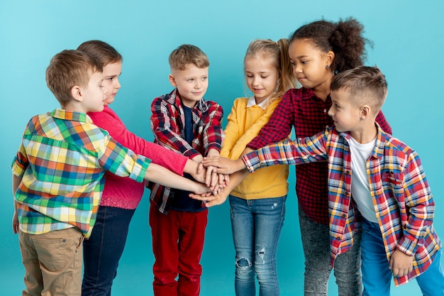 Free Photo group of children doing hand shake