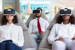 Free photo group of colleagues in vr headsets watching virtual presentation