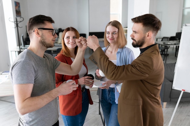 Group of coworkers at the office talking