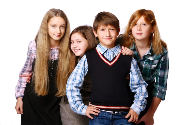 Group of cute and happy kids posing on white background