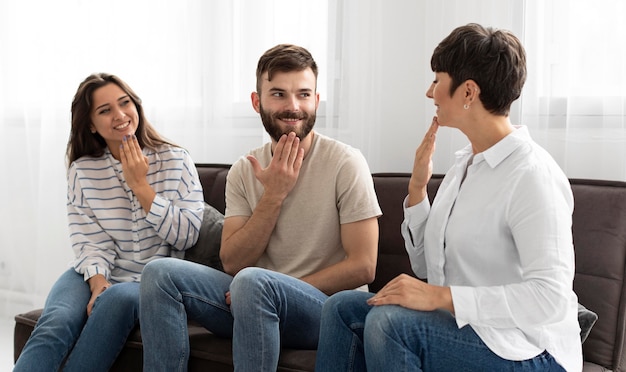 Group of deaf people communicating through sign language