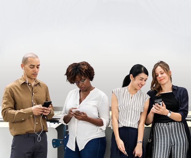 Free photo group of diverse people using smartphones