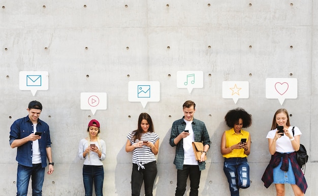 Group of diverse people using their phones