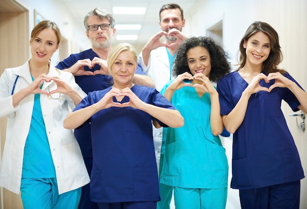 Free photo group of doctors with heart symbol