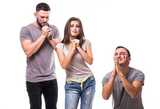 Group of football fans pray for France national team on white background. Football fans concept