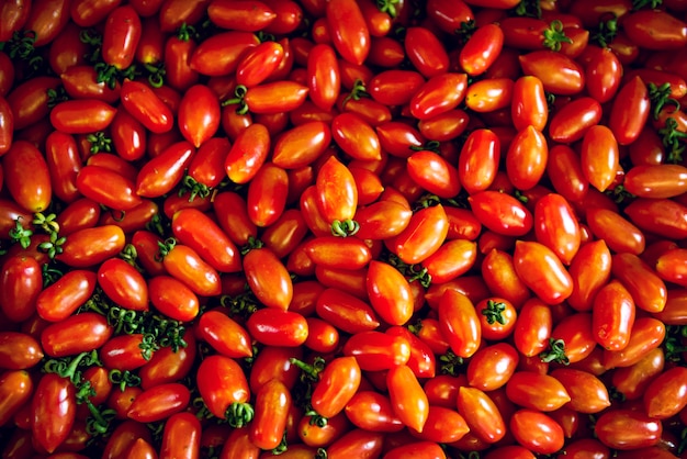 Free photo group of fresh harvest red cherry tomatoes