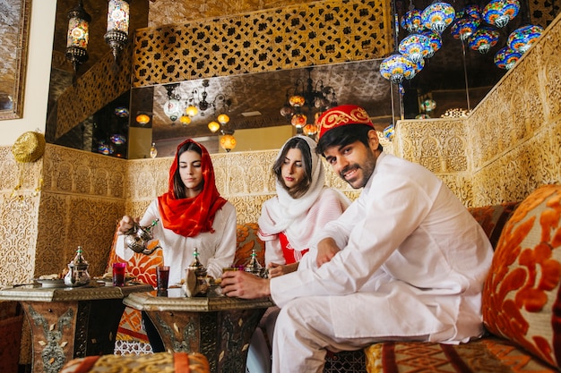 Free Photo group of friends in arab restaurant