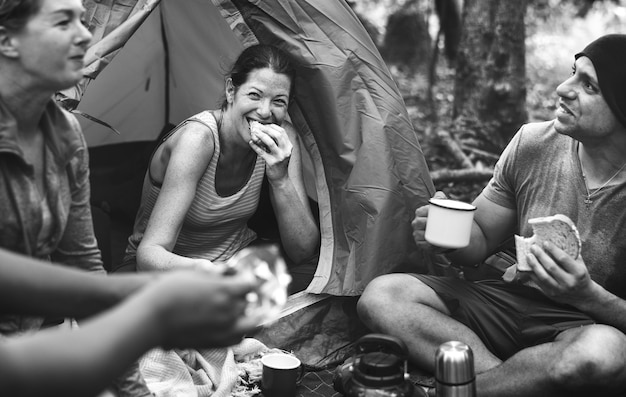 Free photo group of friends camping in the forest