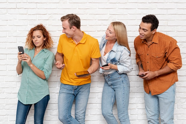 Free photo group of friends checking a phone