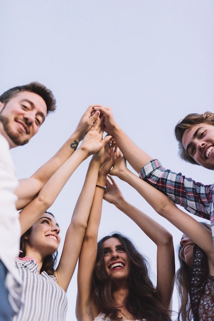 Free photo group of friends clapping hands