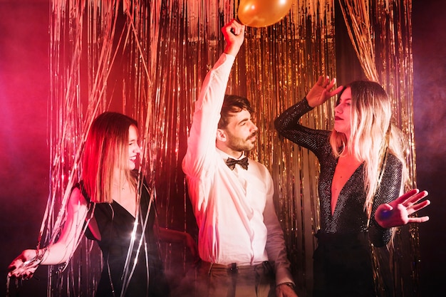 Group of friends dancing at new year party