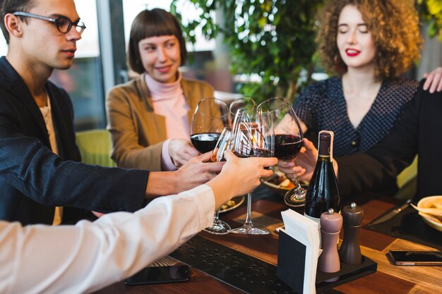 Group of friends eating in restaurant