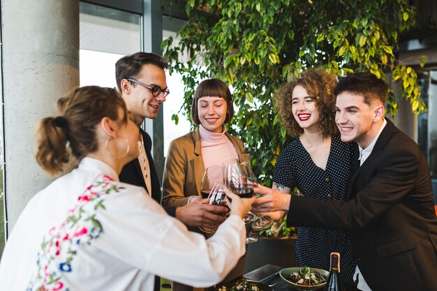 Group of friends eating in restaurant