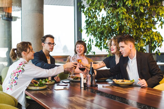 Group of friends eating in restaurant