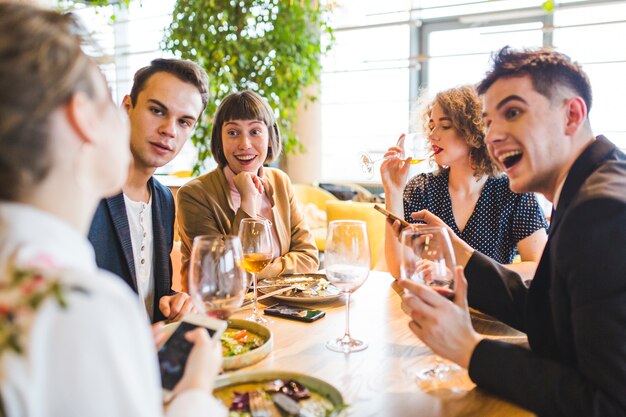 Group of friends eating in restaurant