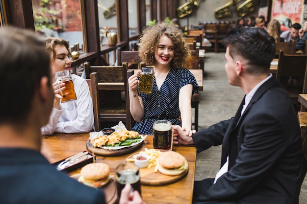 Group of friends eating in restaurant