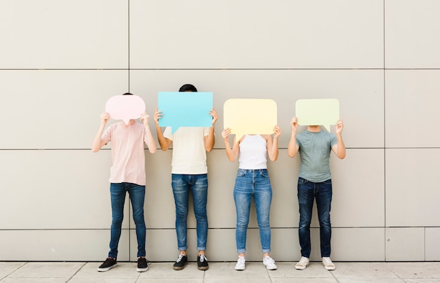 Group of friends holding speech bubbles