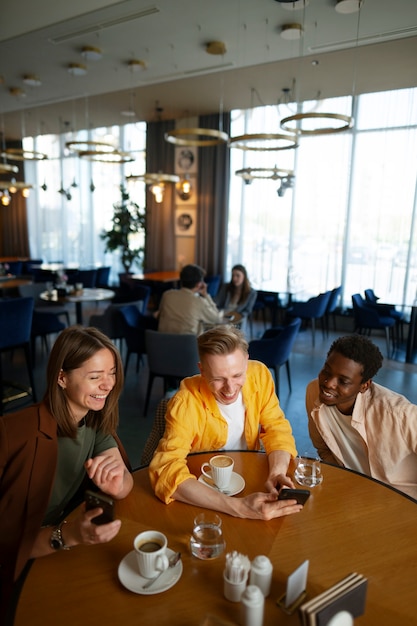 Group of friends looking at the menu together at restaurant