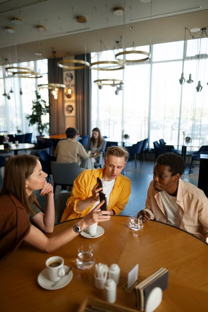 Group of friends looking at the menu together at restaurant