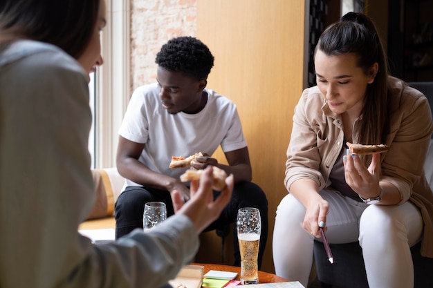 Group of friends planning a trip in a cafe