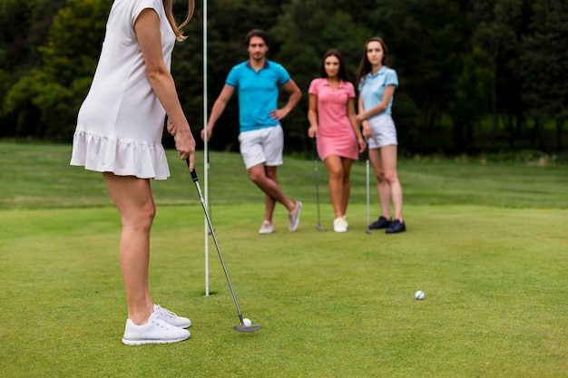 Group of friends playing golf together