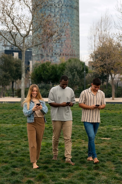 Group of friends reading cell phone messages