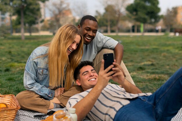 Group of friends reading cell phone messages