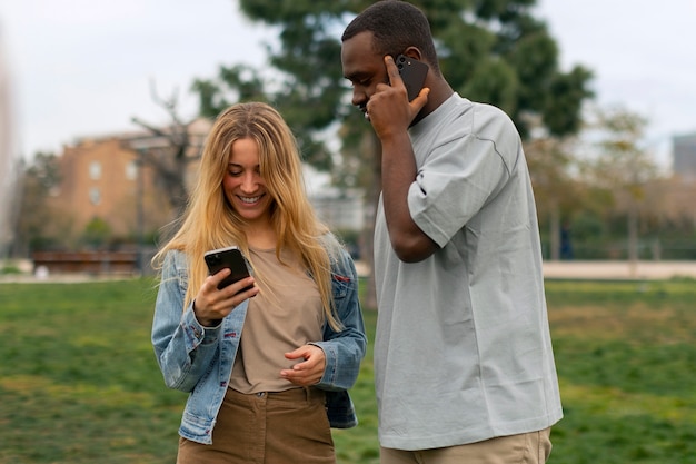 Group of friends reading cell phone messages