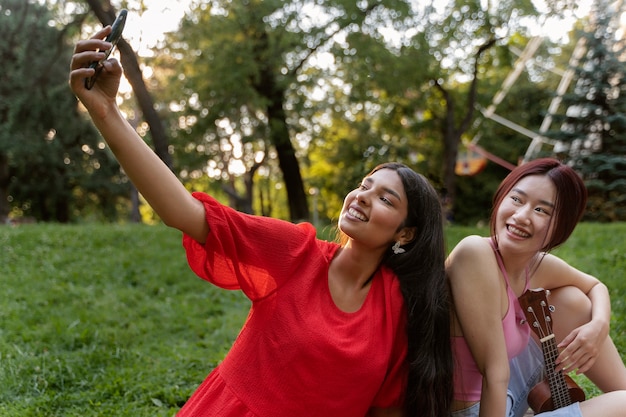 Group of friends taking a selfie while out at the ferris wheel