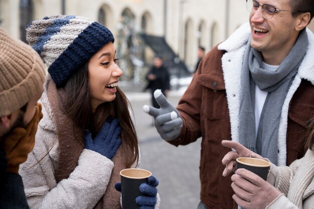 Group of friends talking over a cup of coffee outdoors