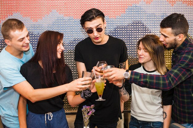 Group of friends toasting cocktails