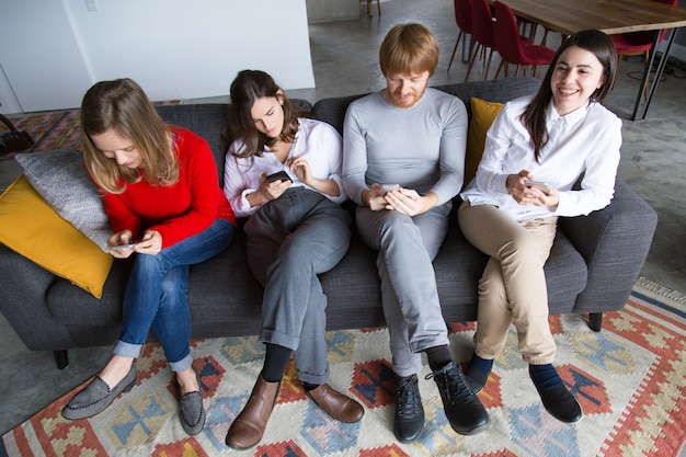 Group of friends using phones