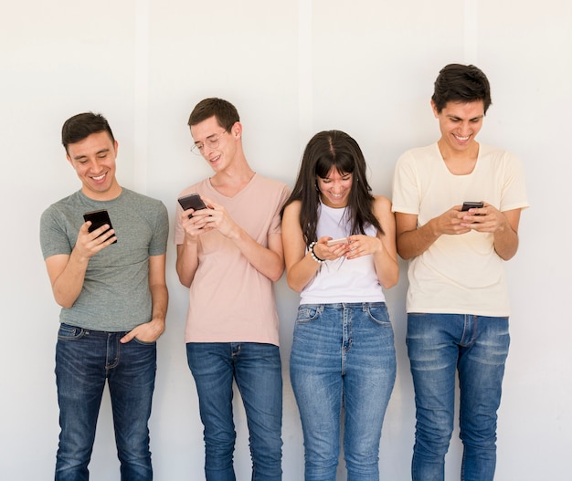 Group of friends with mobile phones