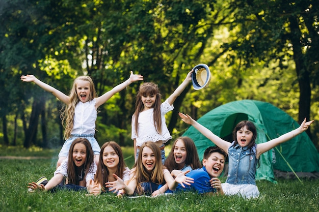 Free photo group of girls camping in forest