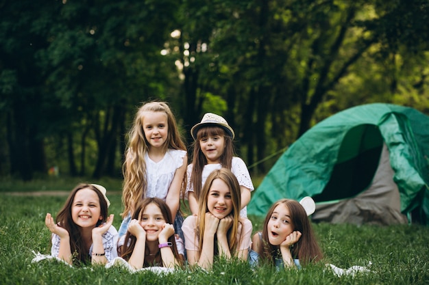 Free photo group of girls camping in forest