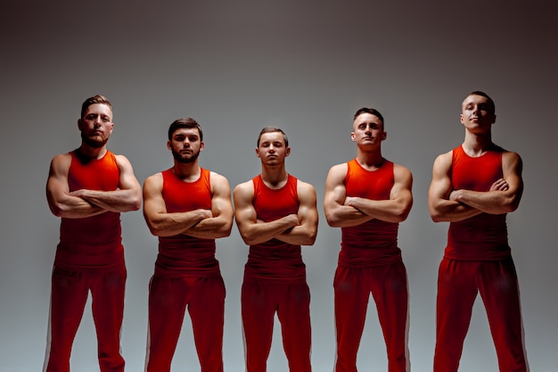 The group of gymnastic acrobatic caucasian men