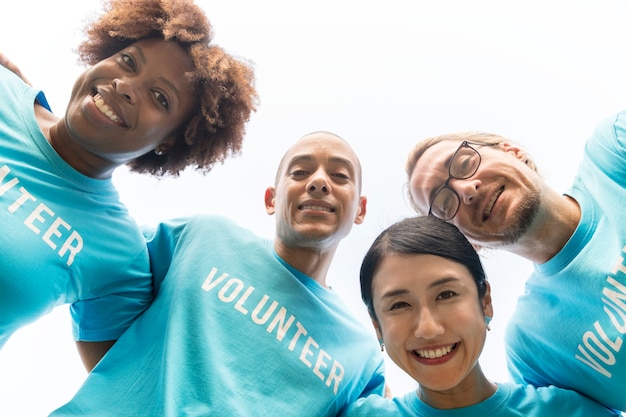 Group of happy and diverse volunteers