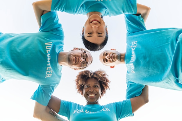 Group of happy and diverse volunteers